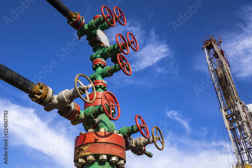 Oil and gas processing plant with pipe line valves. Oil pipeline valves in the oil and gas industry. Valve plug an oil pipeline in the field on a sunny summer day