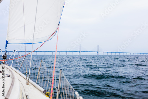 Yacht and oresund bridge between denmark sweden © Voyagerix