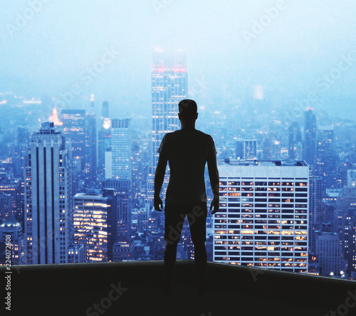 Young man on city backdrop