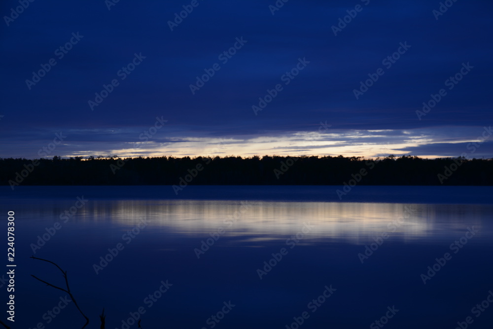 Fototapeta premium blue sunset over lake