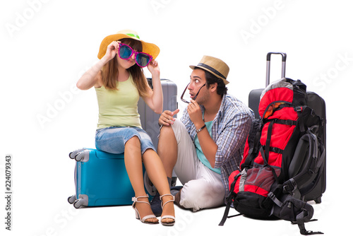 Young family preparing for vacation travel on white © Elnur
