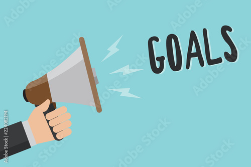 Conceptual hand writing showing Goals. Business photo showcasing persons ambition or effort aim desired result Sport match Winning Man holding megaphone blue background message speaking loud © Artur