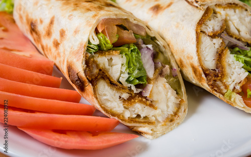 Fried chicken in a pita wrap and sliced