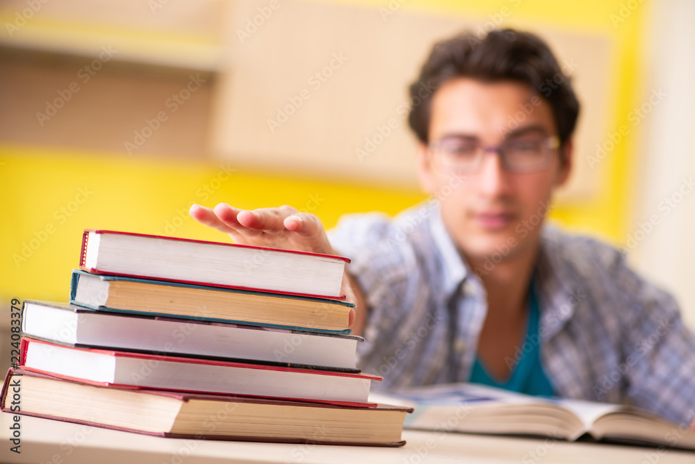 Student preparing for exam sitting at the kitchen Student preparing for exam sitting at the kitchen