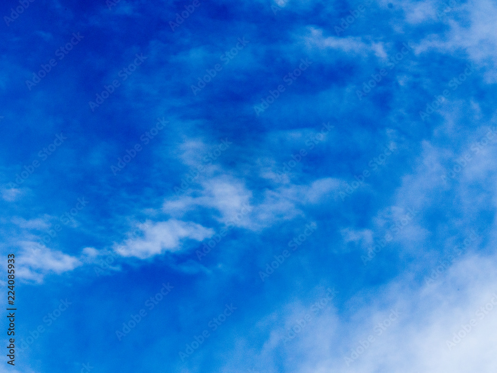 Blue sky with wispy clouds