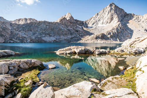 High alpine lake and mountain peak photo