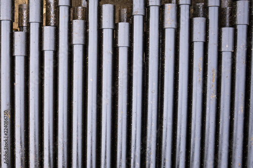 Drilling of oil and gas wells. Drill pipe inspection. Tubing for oil and gas listed on the pedestal out of the wells after washing and ready for inspection. Stack of casing laying on the deck