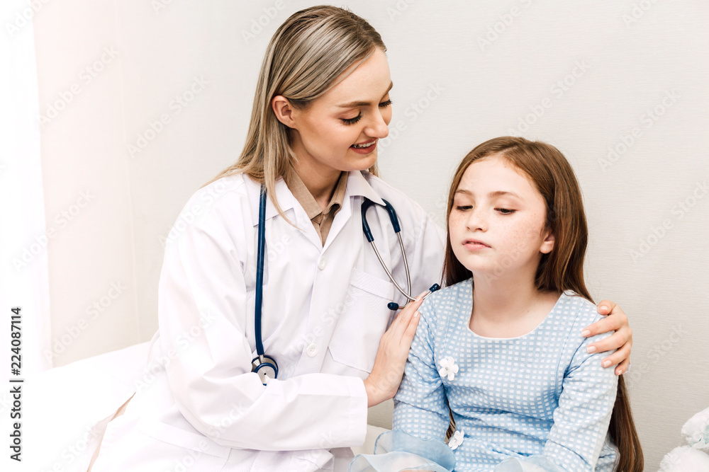 Doctor consulting and consulting with little girl in hospital.A little girl has sick.healthcare and medicine Doctor consulting and consulting with little girl in hospital.A little girl has sick.healthcare and medicine