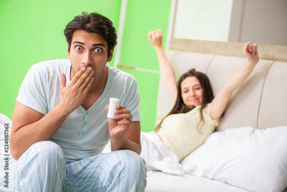 Man using pills for woman satisfaction Man using pills for woman satisfaction