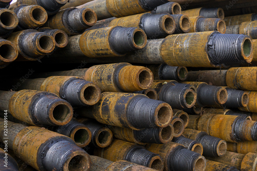 Drilling of oil and gas wells. Drill pipe inspection. Tubing for oil and gas listed on the pedestal out of the wells after washing and ready for inspection. Stack of casing laying on the deck Drilling of oil and gas wells. Drill pipe inspection. Tubing for oil and gas listed on the pedestal out of the wells after washing and ready for inspection. Stack of casing laying on the deck