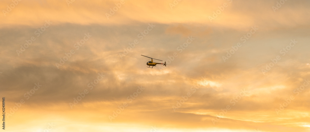 helicopter surveys dangerous wild fires from the safety of the sky