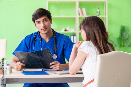 Female patient visiting male doctor in medical concept 