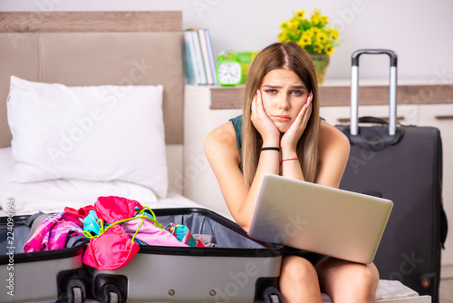 Young woman getting ready for summer vacation photo