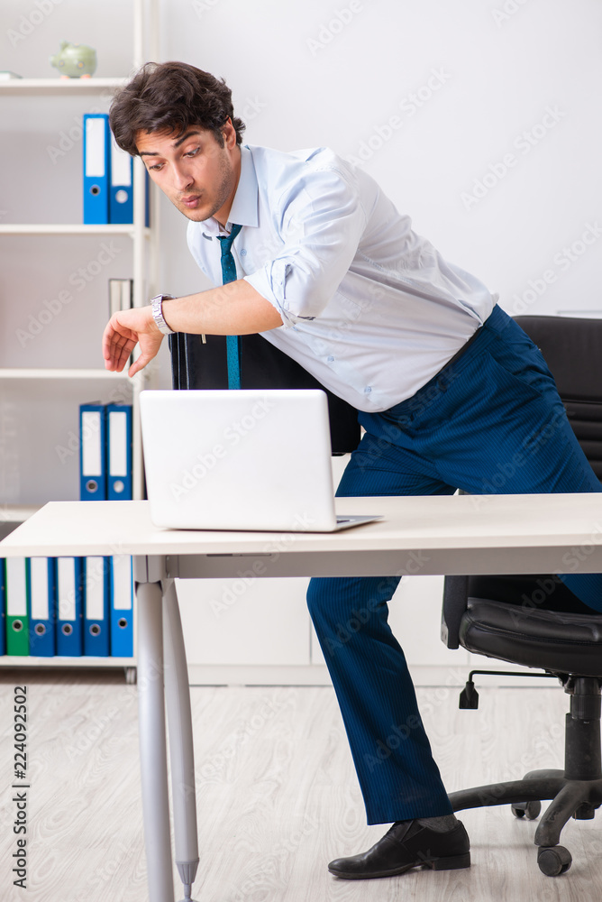 Overloaded busy employee with too much work and paperwork Overloaded busy employee with too much work and paperwork