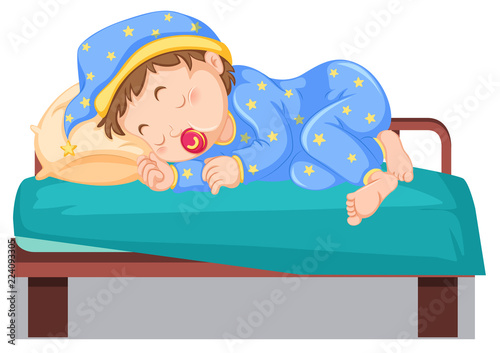 Young child sleeping on bed photo