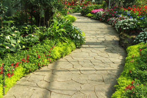 Stone walkway in flower garden. photo