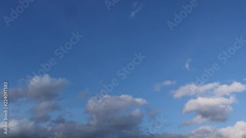 Dramatic atmosphere panorama view 4K Time-lapse footage video clip of blue sky and clouds on beautiful summer day.
