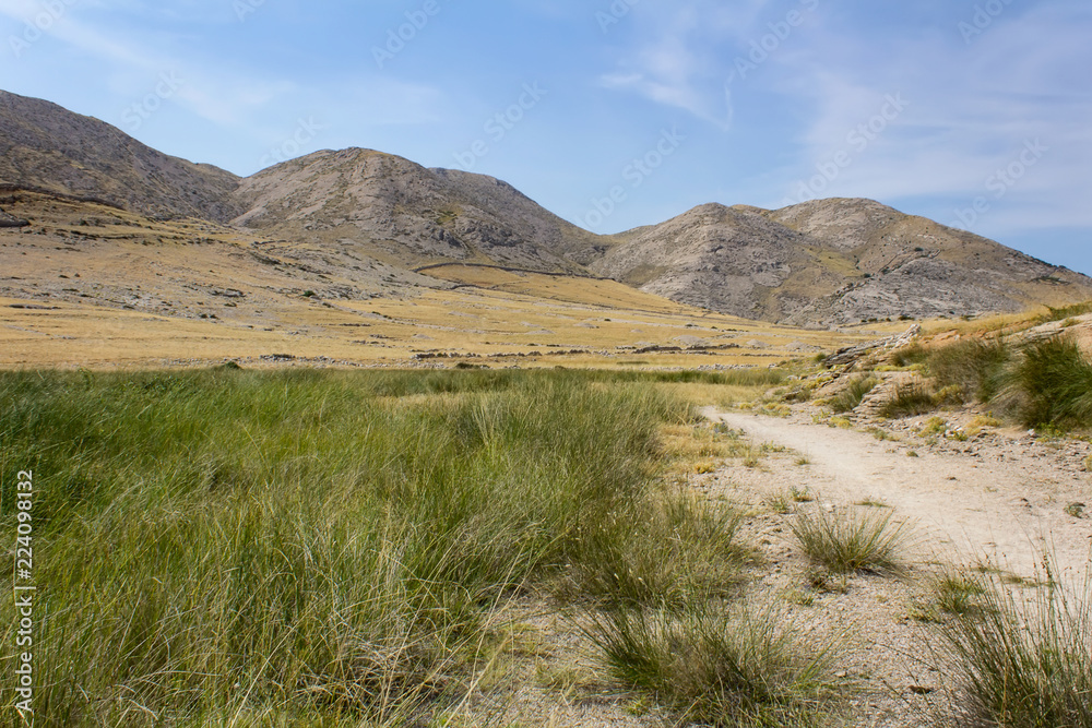 Nice mountains with high green grass, island Krk, Croatia Nice mountains with high green grass, island Krk, Croatia