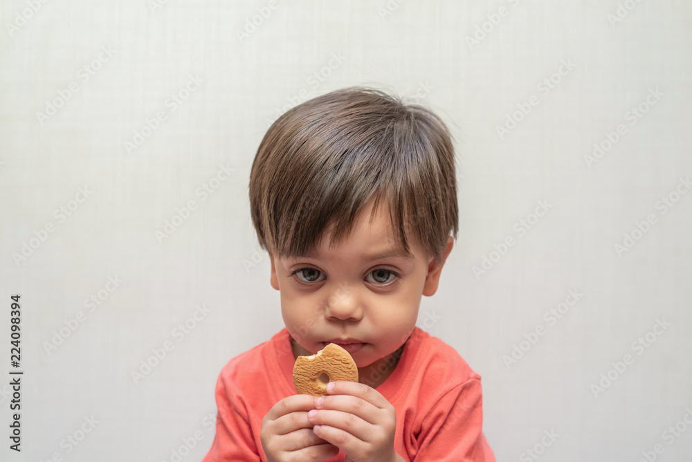 Cute baby boy toddler - eating wafer biscuit Cute baby boy toddler - eating wafer biscuit