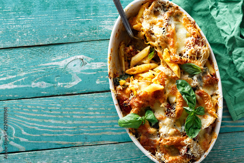 Принти на полотні Baked pasta chicken ham parmesan pumpkin comfort food top view
