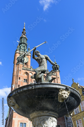 17th century Neptune's Fountain Statue at Long Market Street next to Main Town Hall, Gdansk, Poland.
