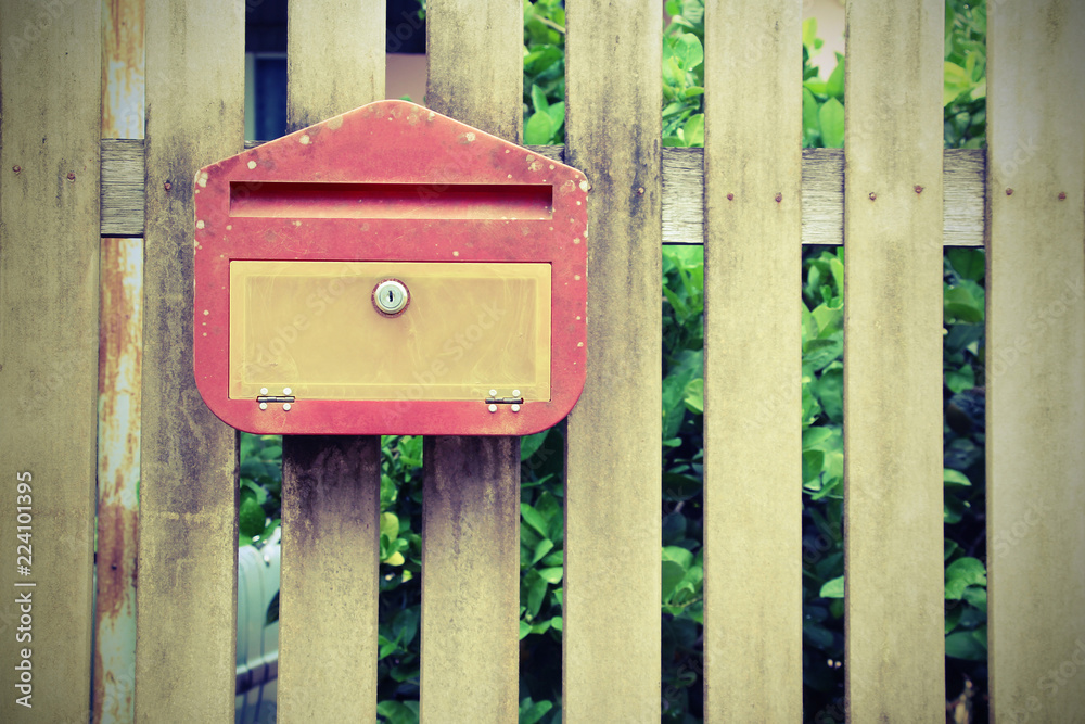 Traditional old mail box on the wooden wall Traditional old mail box on the wooden wall