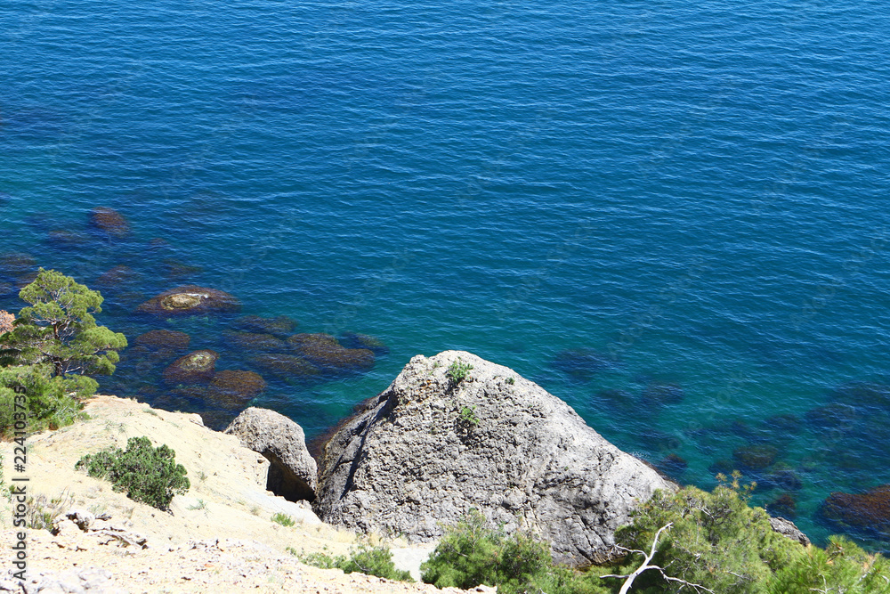 nice rocky blue sea beach with large stones on a summer day, photo of nature nice rocky blue sea beach with large stones on a summer day, photo of nature