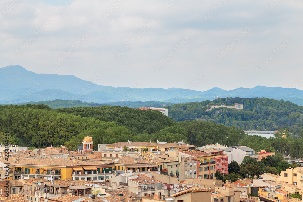 roofs of Girona on the background of the mountains