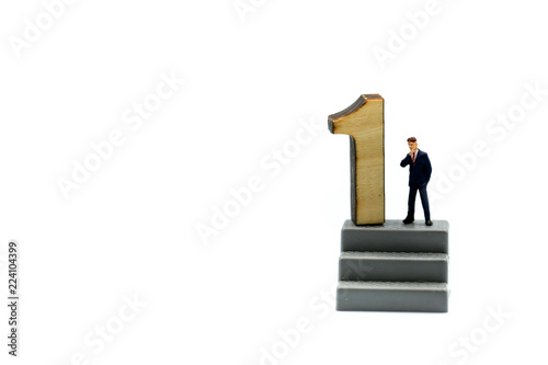Miniature people : Businessman and team with wooden number of 1,2,3 , to be the first,business competition concept.