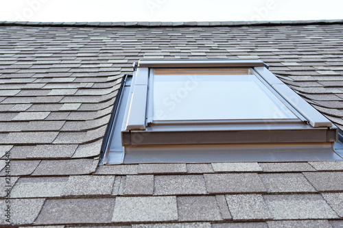 Wallpaper Mural Grey asphalt shingles house roofing construction with attic roof window skylights waterproofing closeup view. Torontodigital.ca