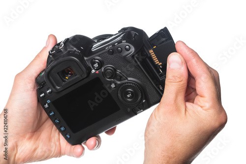 Photo camera in hand isolated on white background