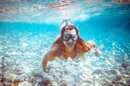 Girl snorkeling underwater in the tropical sea © leszekglasner