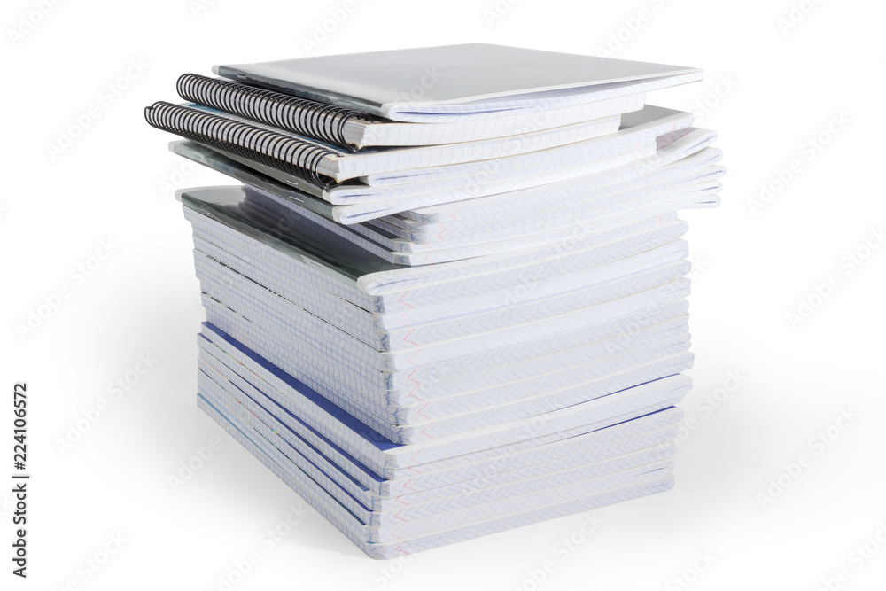 Big stack of the different exercise books on white background Big stack of the different exercise books on white background