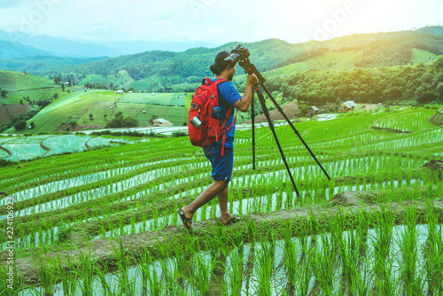 man asians natural travel relax. Walking take aPhoto of Rice Field. in summer. photo