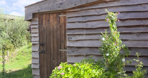 timber garden shed with a hinged door and sawed bargeboard photo
