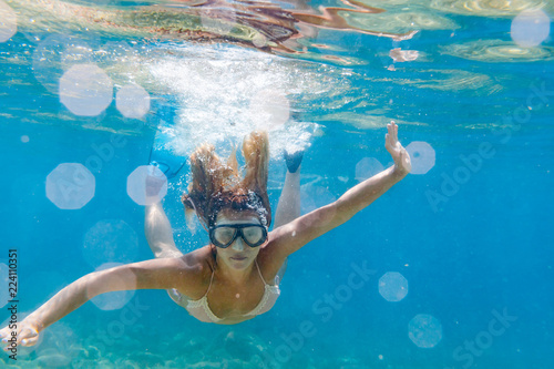 Woman snorkeling in the clear sea water