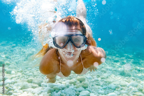 Woman snorkeling in the clear sea water © leszekglasner