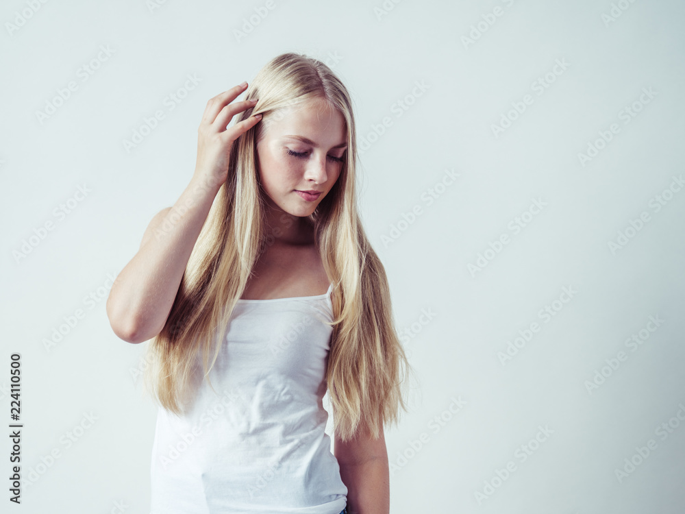Blonde woman with long smooth hair natural portrait Blonde woman with long smooth hair natural portrait