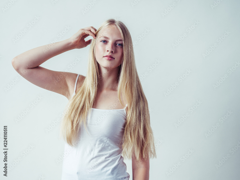 Blonde woman with long smooth hair natural portrait Blonde woman with long smooth hair natural portrait