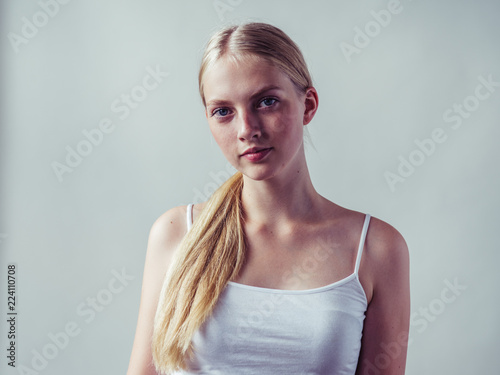 Blonde woman with long smooth hair natural portrait