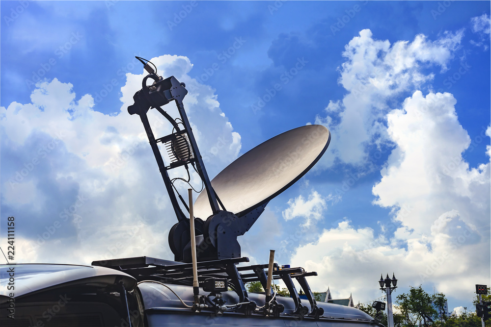Mobile Satellite Receiver on top of car.