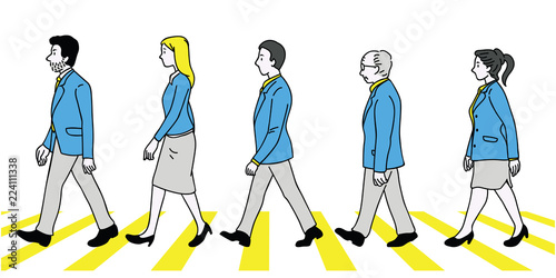 Businesspeople walking zebra crossing