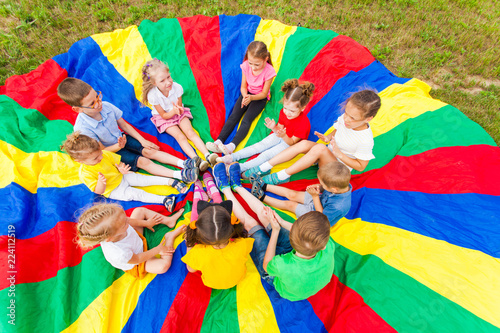 Group of kids on the lawn in the summer outdoors photo