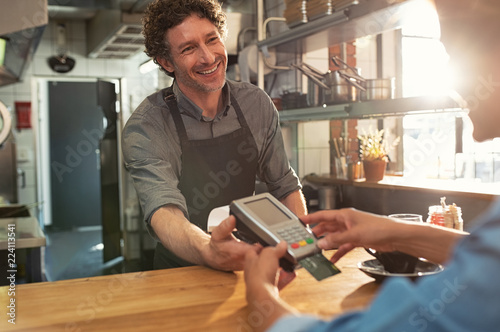 Waiter accepting payment by card
