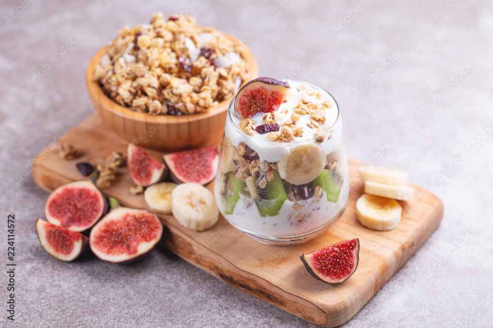 Granola with yogurt, bananas and figs. Copy space Granola with yogurt, bananas and figs. Copy space