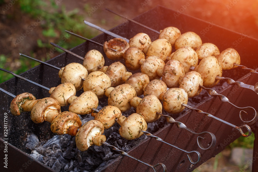 Barbecue skewers with grilled champignon mushroom kebab in a brazier