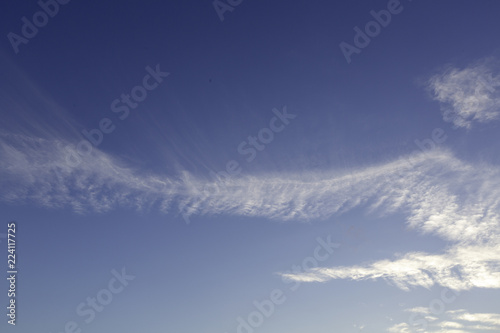 A background photo of Cirrus clouds in the sky.