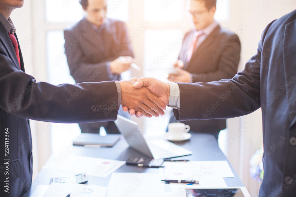 After meeting business people shaking hands with new partner meeting to jointly invest in business together. After meeting business people shaking hands with new partner meeting to jointly invest in business together.