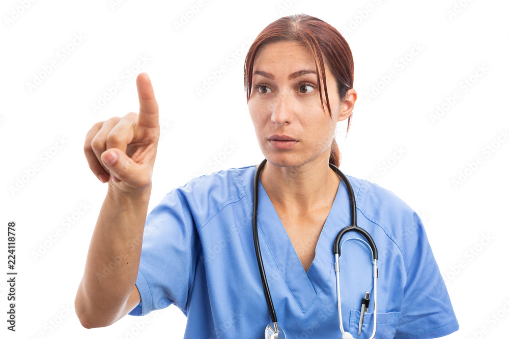 Curious woman nurse or medic touching invisible digital screen. Curious woman nurse or medic touching invisible digital screen.