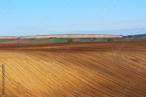 Farm land with plowed soil